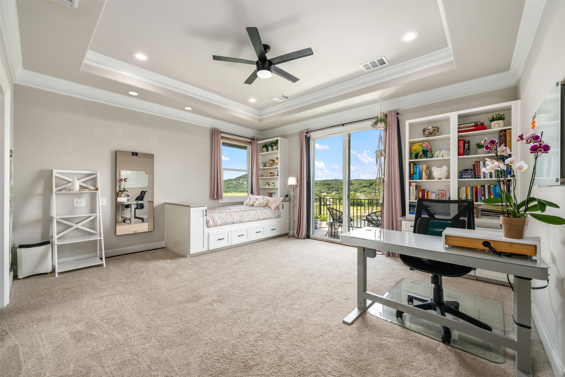 10716 Beach Road Leander, TX 78641 - Photo 21 of 39 Carpeted home office with a tray ceiling, a ceiling fan, and crown molding