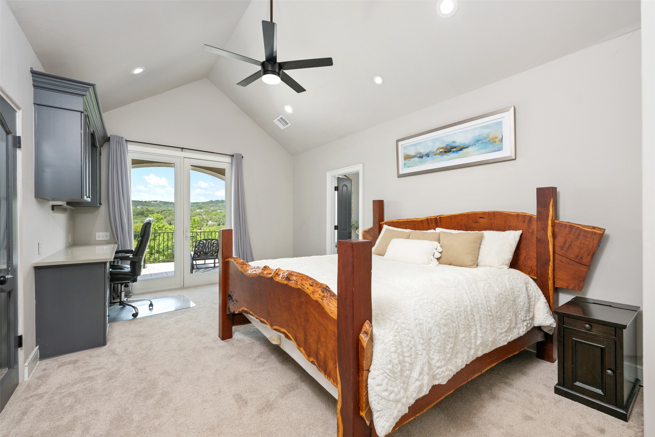 10716 Beach Road Leander, TX 78641 - Photo 23 of 39 Bedroom featuring access to outside, vaulted ceiling, light colored carpet, a desk, and a ceiling fan