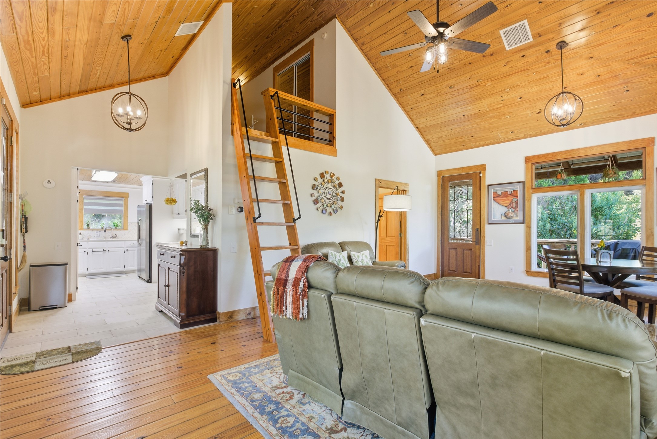 10716 Beach Road Leander, TX 78641 - Photo 33 of 39 Living area featuring a chandelier, high vaulted ceiling, light wood-type flooring, plenty of natural light, and wood ceiling