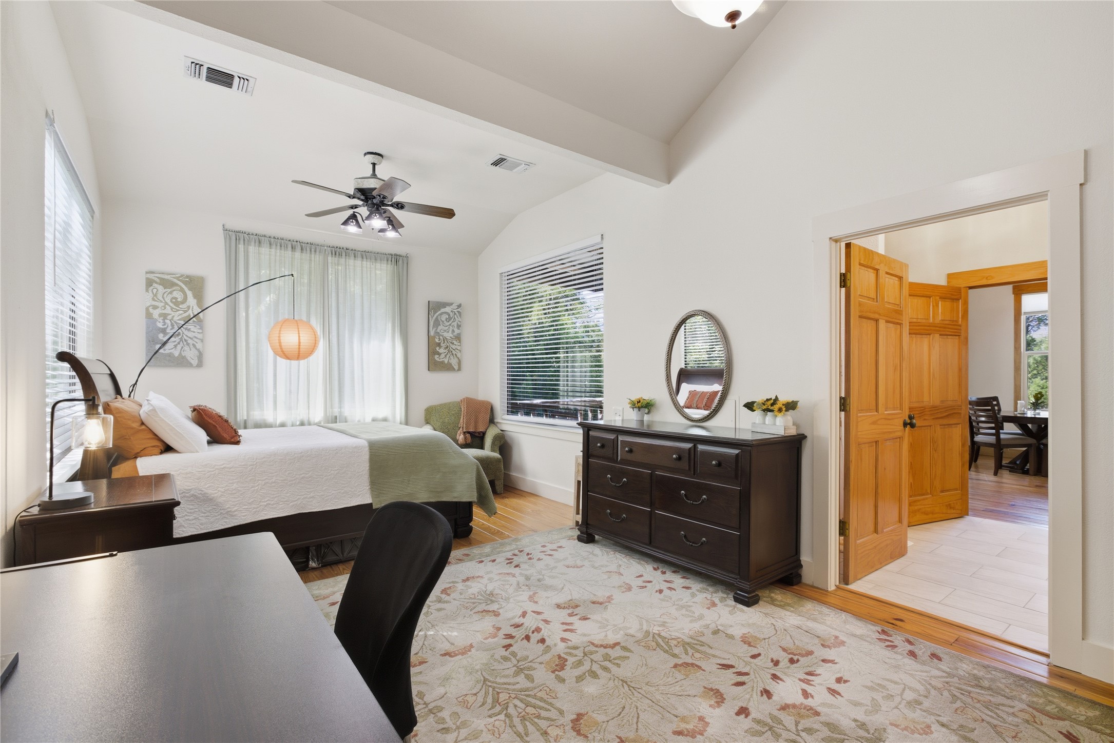 10716 Beach Road Leander, TX 78641 - Photo 36 of 39 Bedroom featuring multiple windows, light wood-type flooring, and a ceiling fan