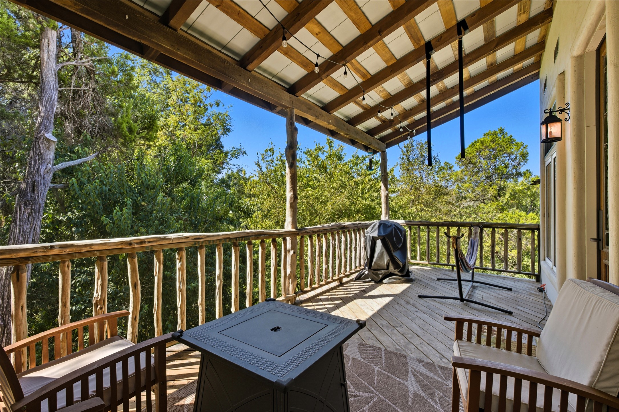 10716 Beach Road Leander, TX 78641 - Photo 39 of 39 Deck with grilling area and view of wooded area