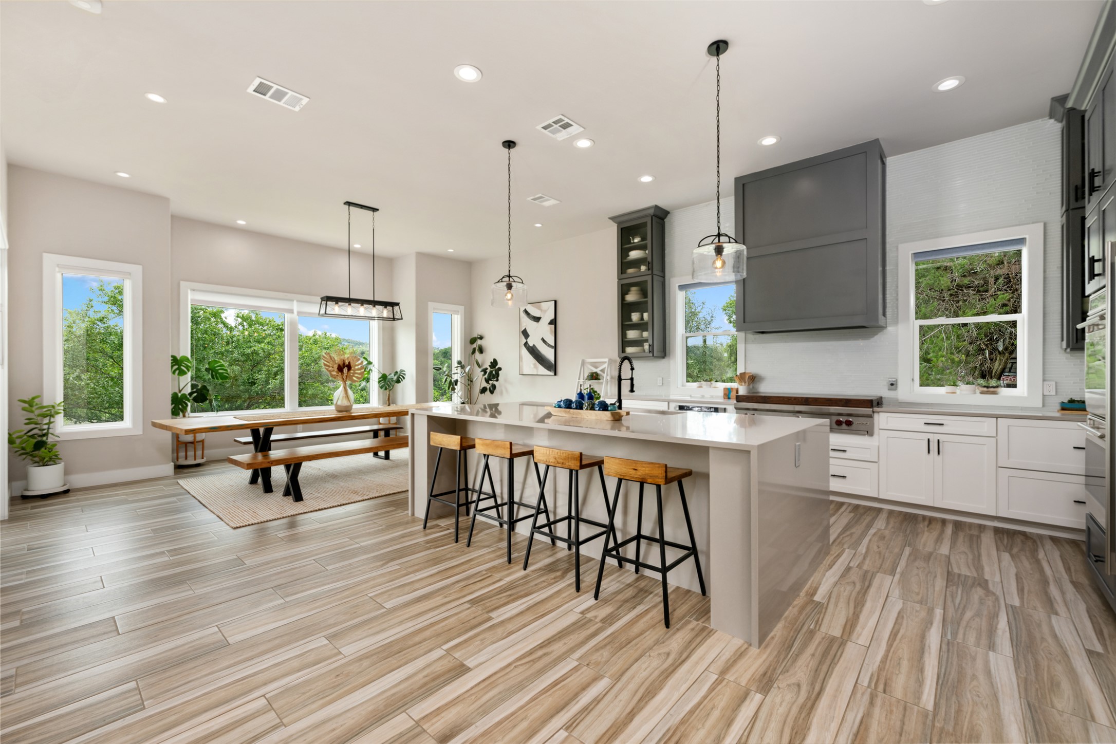 10716 Beach Road Leander, TX 78641 - Photo 6 of 39 Kitchen featuring light countertops, an island with sink, recessed lighting, a breakfast bar area, and light wood-type flooring