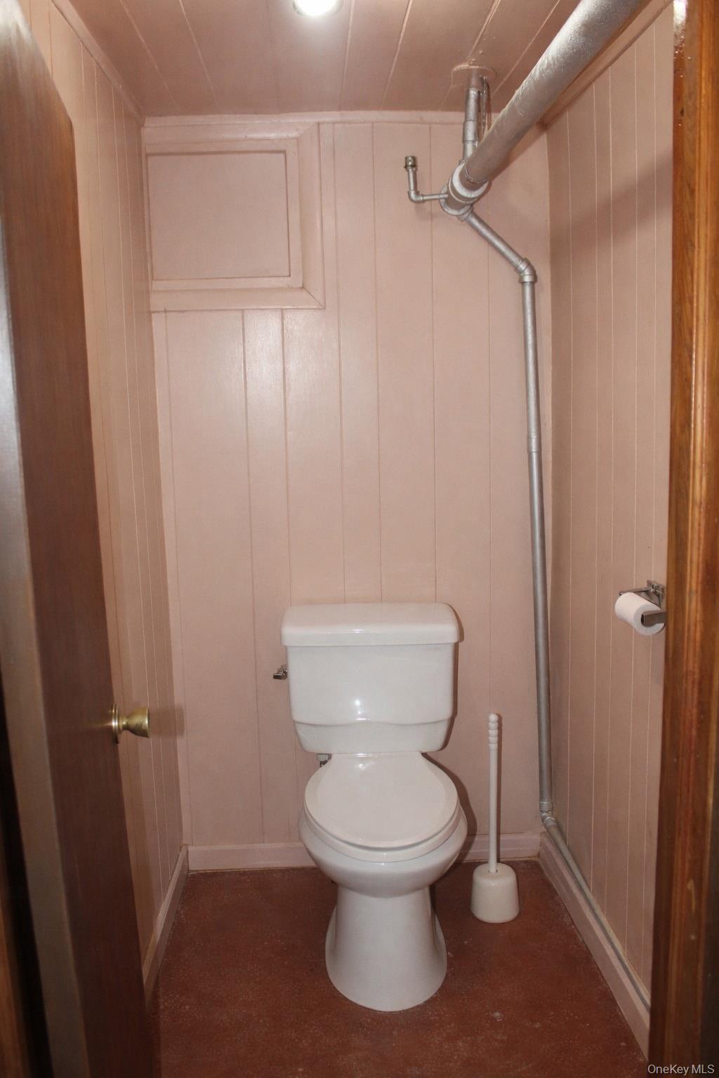 131-16 226th Street Queens, NY 11413 - Photo 12 of 12 a white toilet sitting next to a bathroom sink