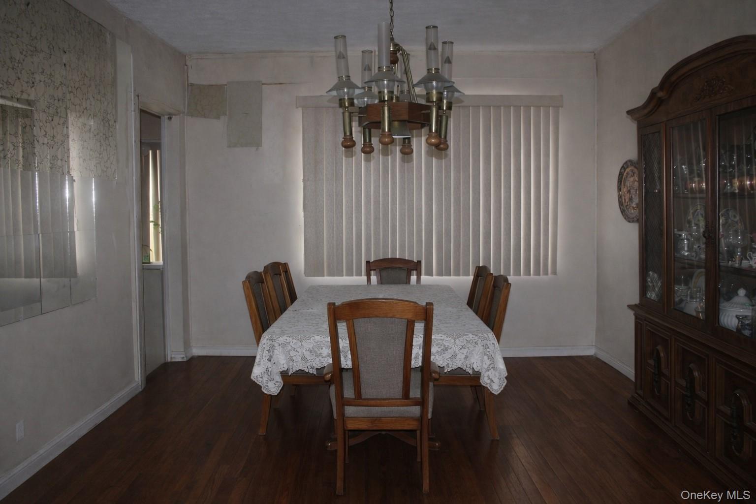131-16 226th Street Queens, NY 11413 - Photo 3 of 12 a view of a dining room with furniture and wooden floor