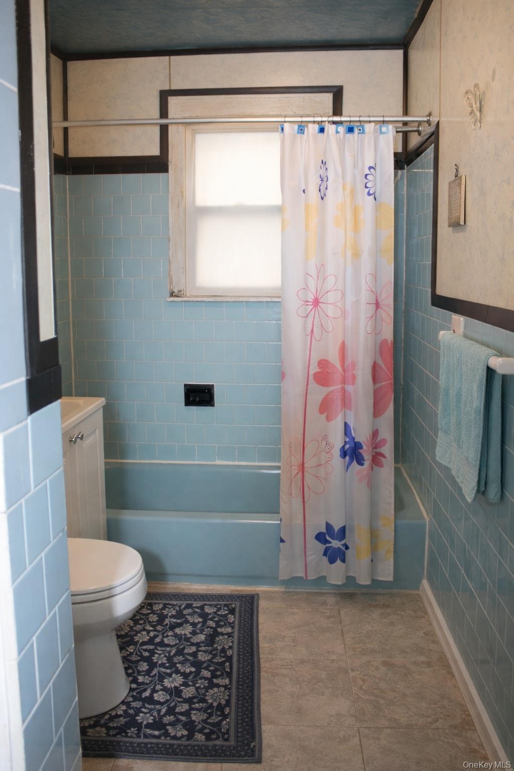 131-16 226th Street Queens, NY 11413 - Photo 6 of 12 a bathroom with a toilet and a shower