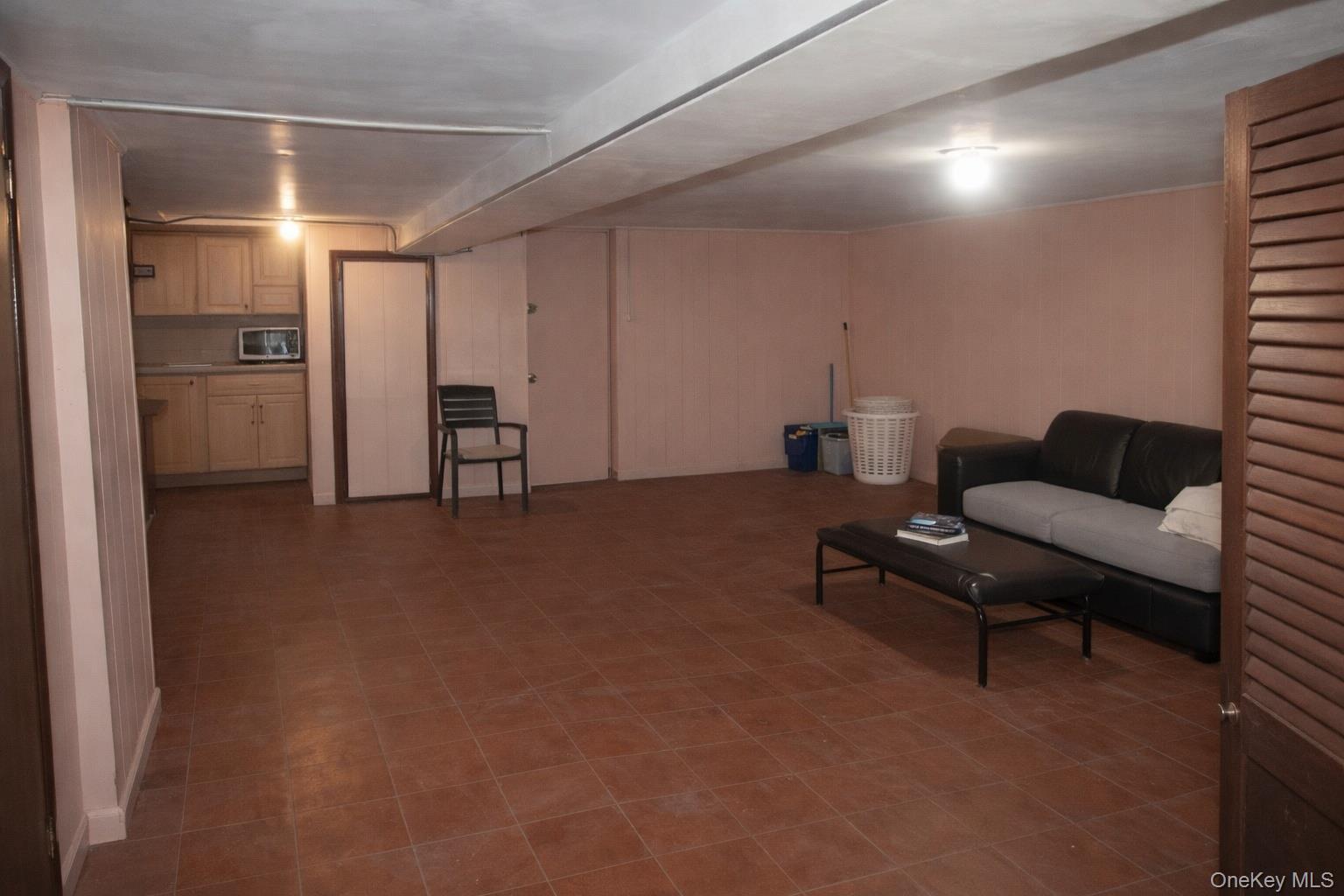 131-16 226th Street Queens, NY 11413 - Photo 9 of 12 a living room with furniture and a area