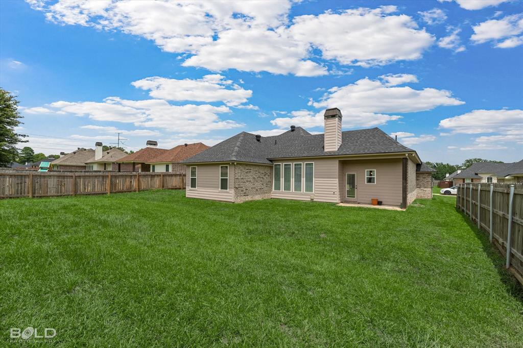 6896 Bethany Reed Circle Blanchard, LA 71107 - Photo 8 of 37 Expansive green lawn with a full privacy fence