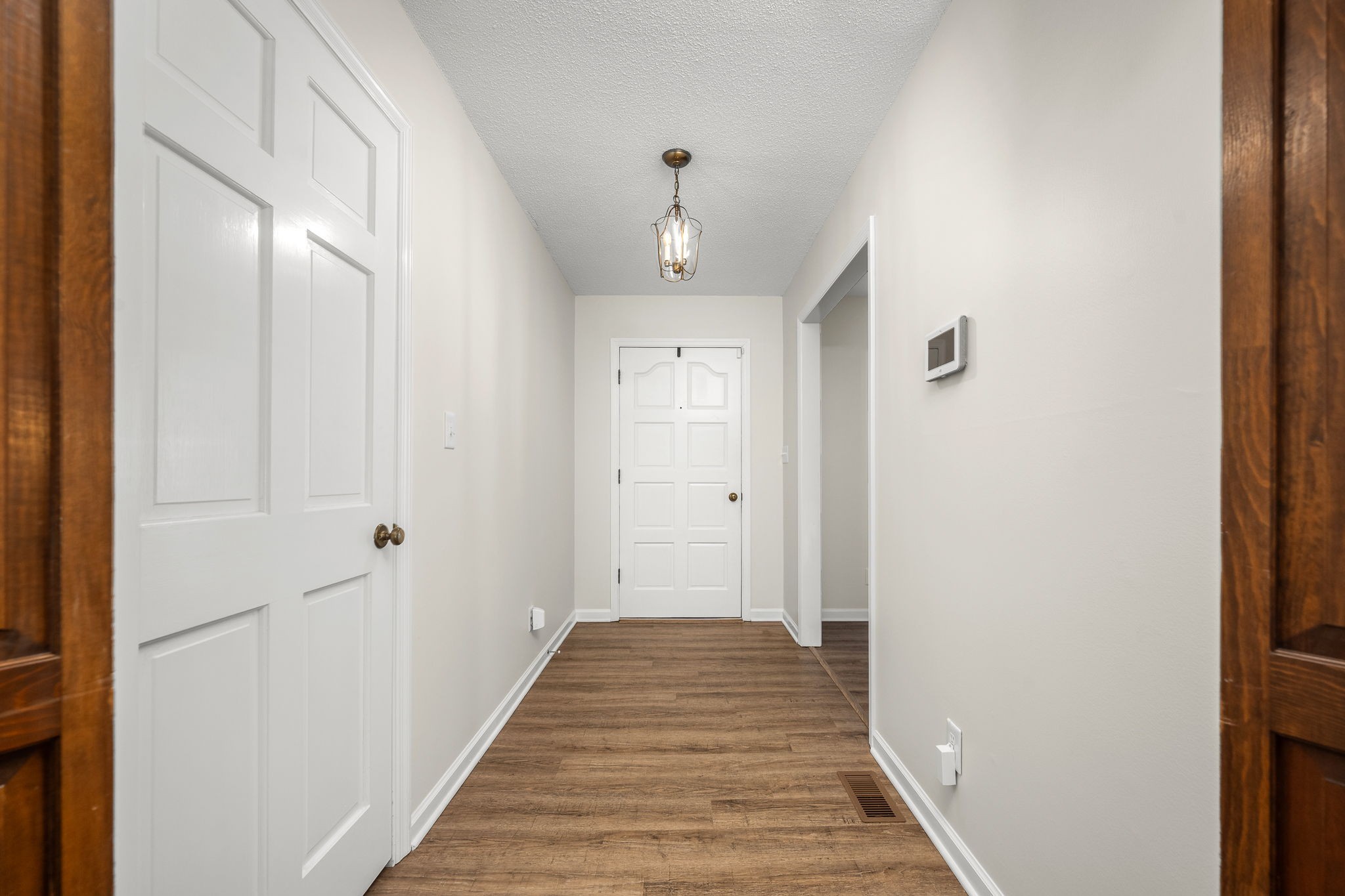 109 Hampshire Road Shelbyville, TN 37160 - Photo 12 of 55 a view of a hallway with wooden floor and a bathroom