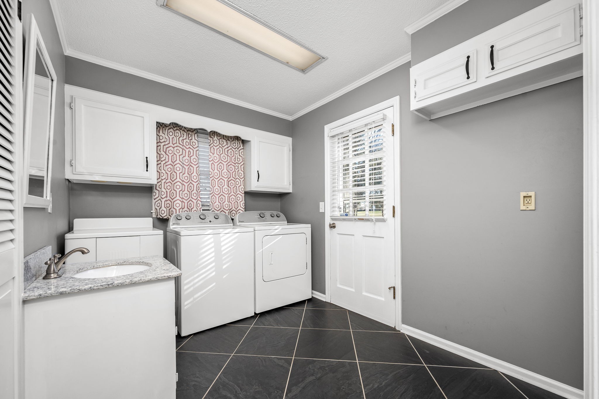 109 Hampshire Road Shelbyville, TN 37160 - Photo 23 of 55 a utility room with cabinets washer and dryer