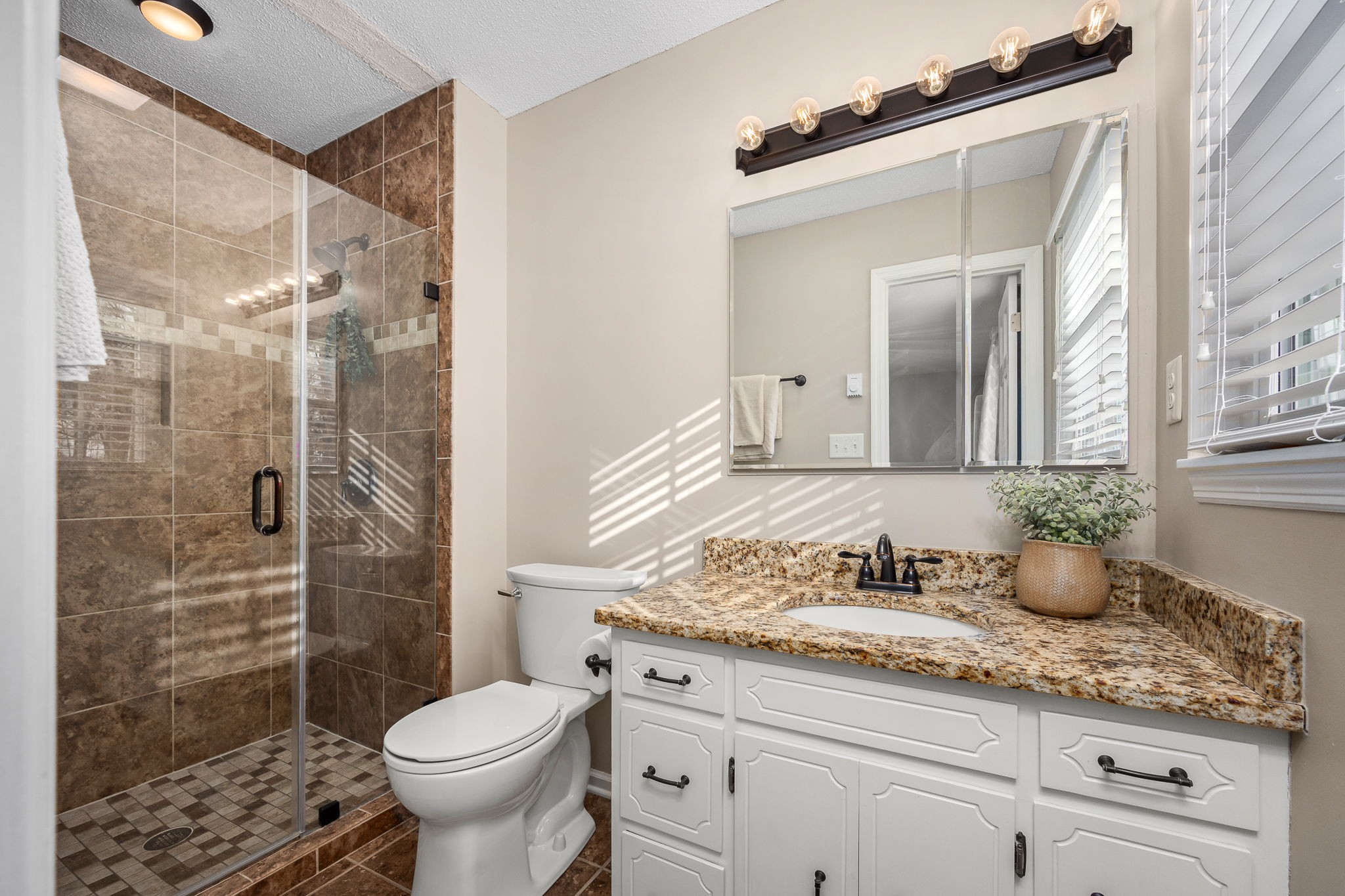 109 Hampshire Road Shelbyville, TN 37160 - Photo 33 of 55 a bathroom with a granite countertop sink toilet and shower