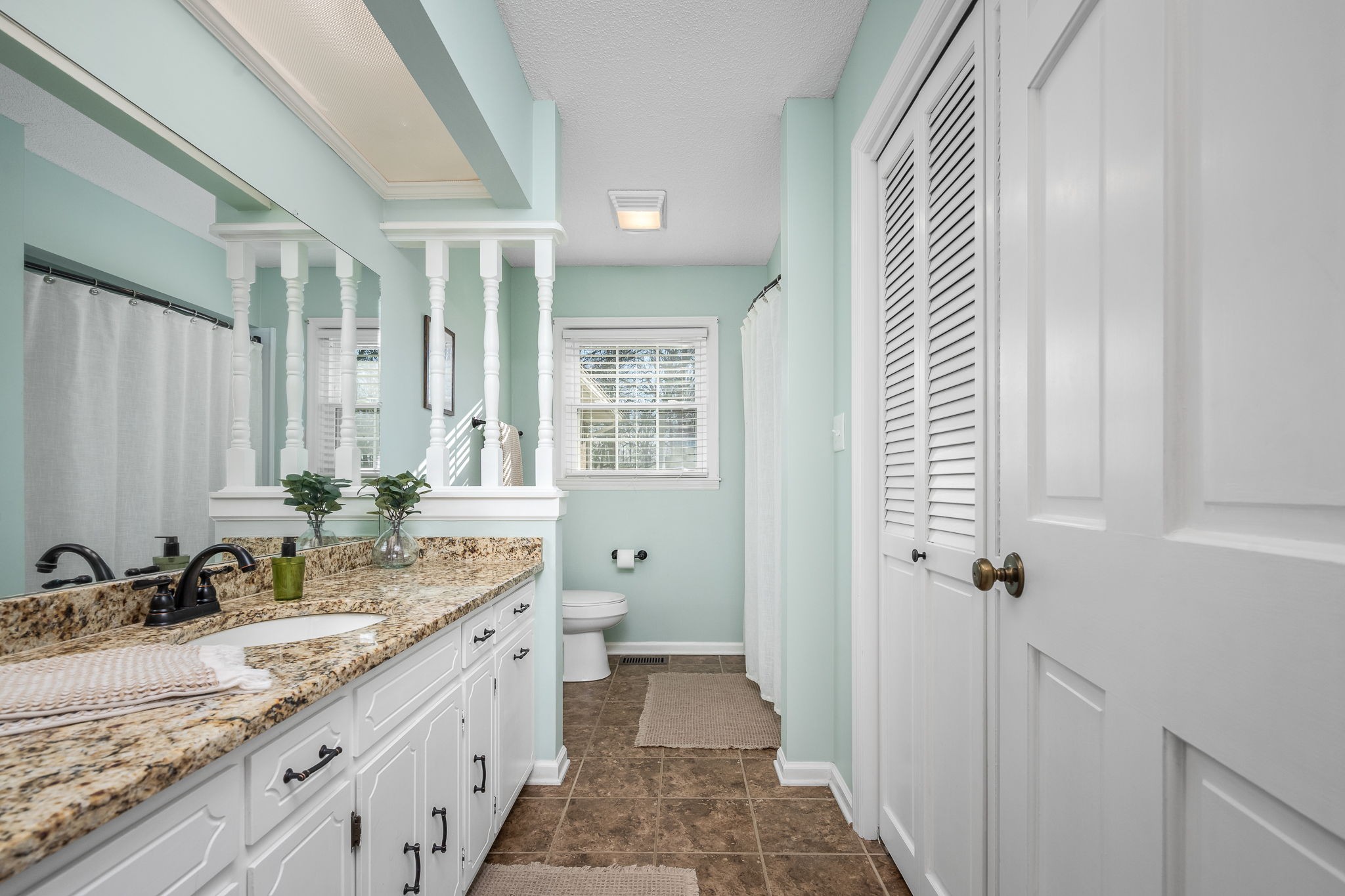 109 Hampshire Road Shelbyville, TN 37160 - Photo 37 of 55 a bathroom with a granite countertop sink and a mirror