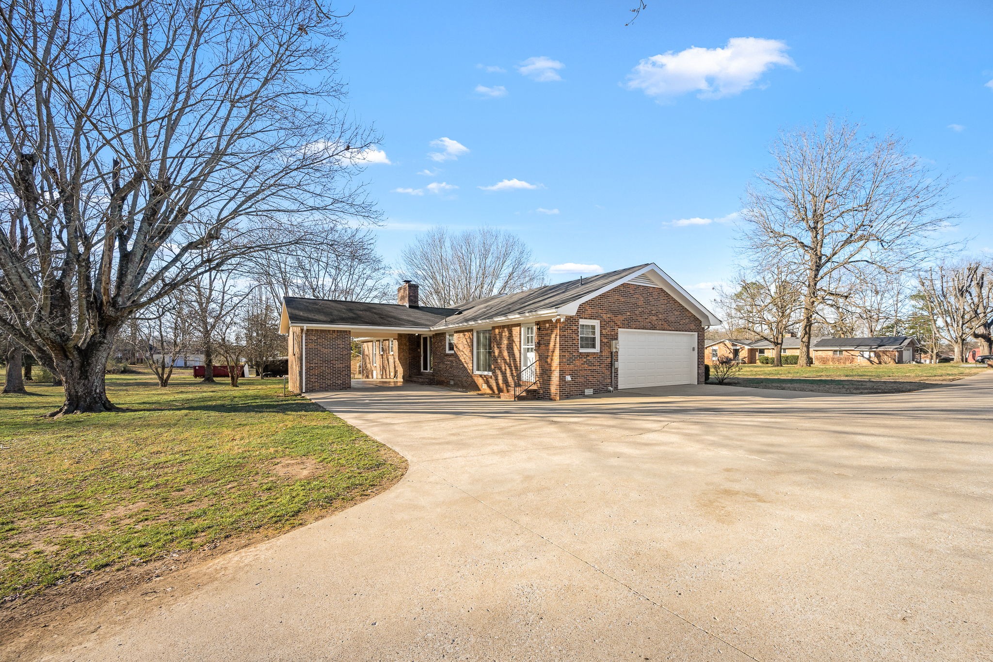 109 Hampshire Road Shelbyville, TN 37160 - Photo 45 of 55 a front view of a house with a yard and garage