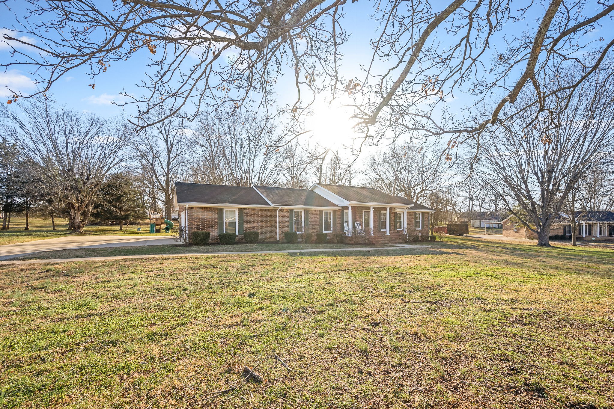 109 Hampshire Road Shelbyville, TN 37160 - Photo 6 of 55 a front view of a house with swimming pool and trees