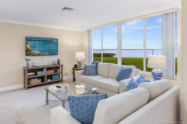 a bedroom with a bed a lamp and a window