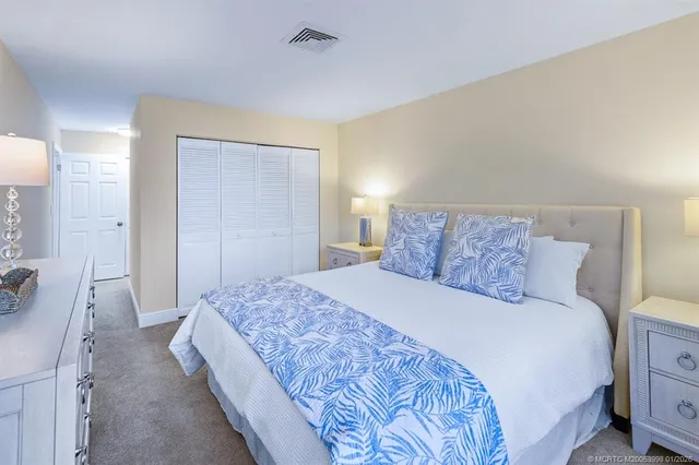 a view of a swimming pool with chairs