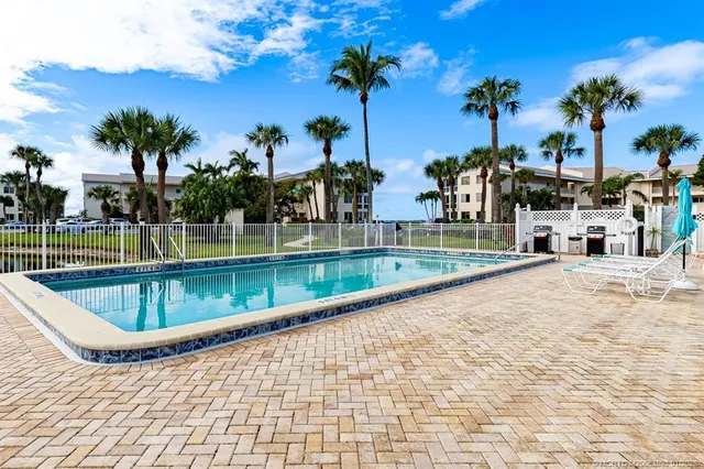 an aerial view of a city with ocean view