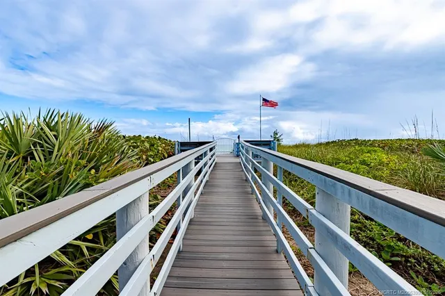 an aerial view of residential houses with outdoor space and street view