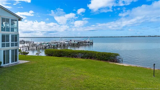 a view of a lake with a house in the background