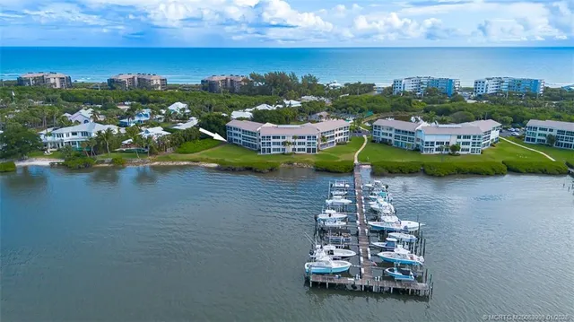 a view of a lake with a house in the background