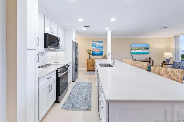 a kitchen with a table and chairs in it