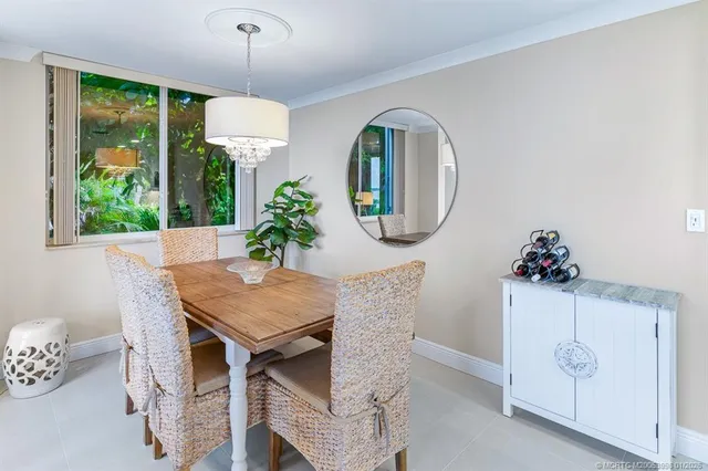 a living room with furniture a rug and a window