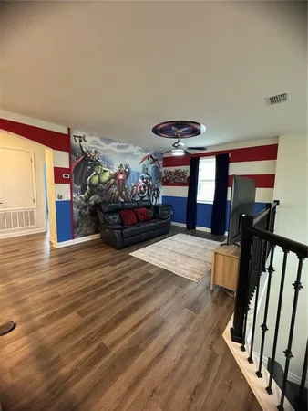 a bedroom with furniture and a fireplace