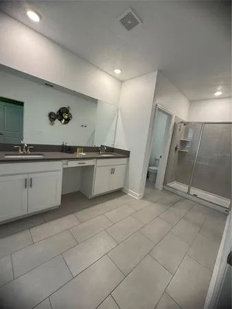 a view of a kitchen with a sink and cabinets