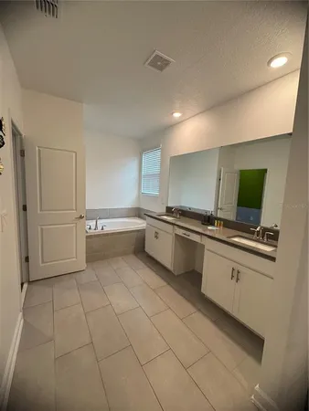 a kitchen with stainless steel appliances a sink and cabinets