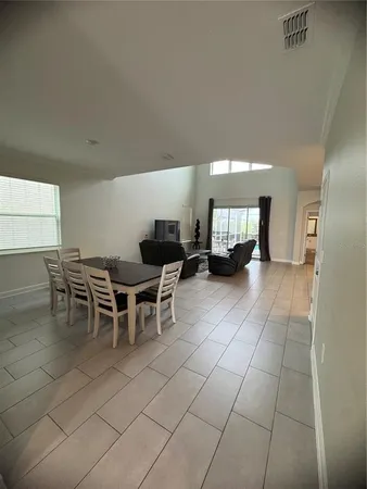 a lobby with furniture and a potted plant