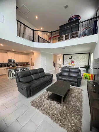 a living room with furniture and a rug