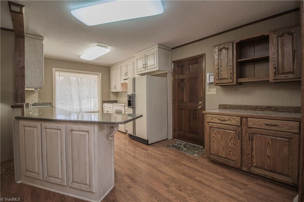 772 Bescher Chapel Road Trinity, NC 27370 - Photo 3 of 29 Bright, open kitchen, with superb quality custom cabinets by Danny Burgess.
