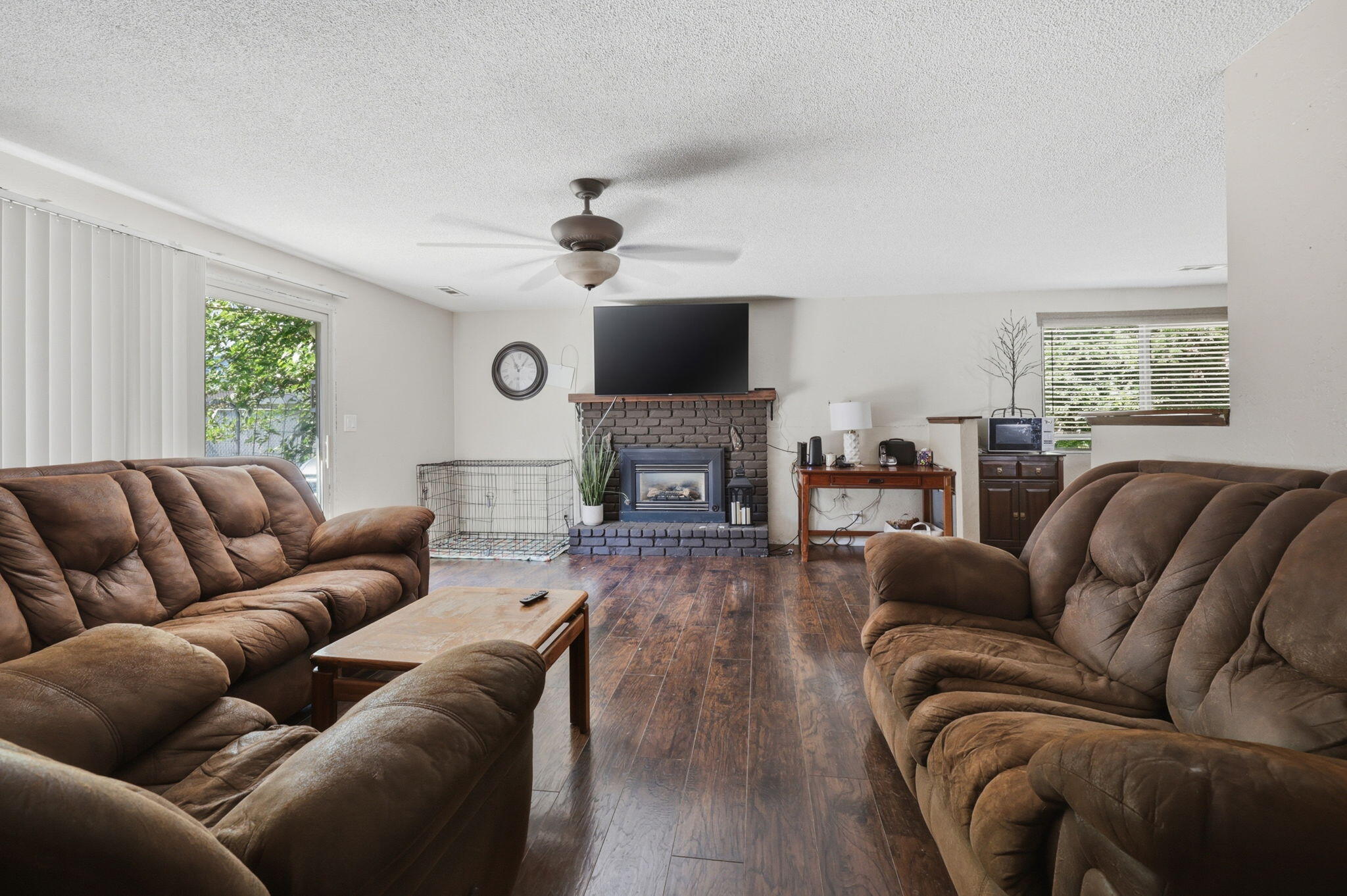 102 Elm Street Phoenix, OR 97535 - Photo 10 of 28 a living room with furniture fireplace and a flat screen tv