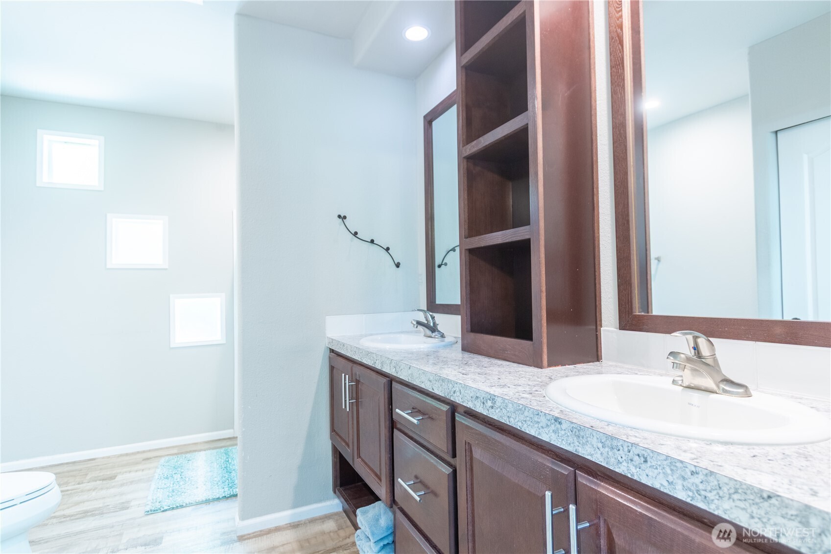 3111 East Rasor Road Belfair, WA 98528 - Photo 14 of 26 a bathroom with a granite countertop sink and a mirror