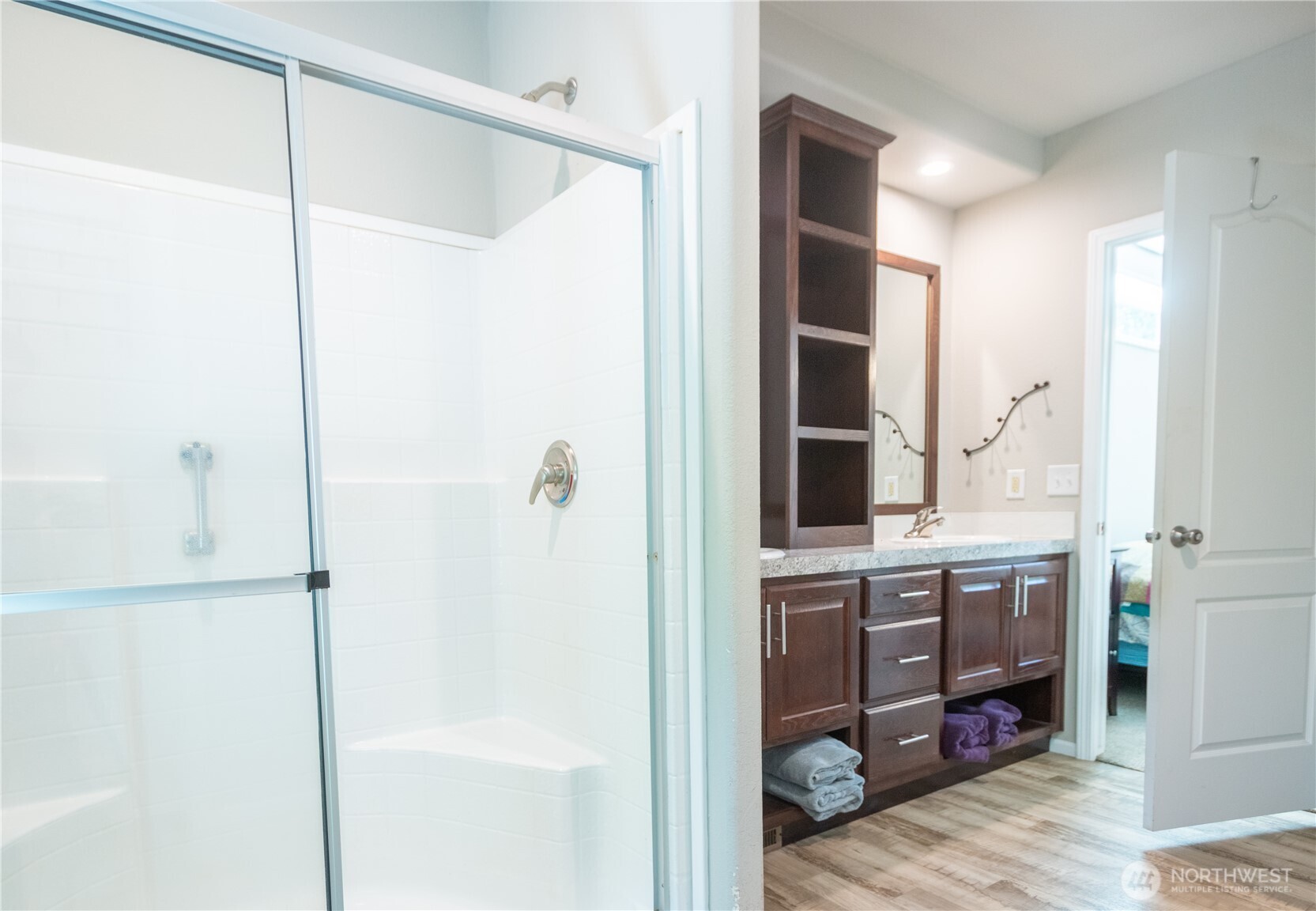 3111 East Rasor Road Belfair, WA 98528 - Photo 16 of 26 a bathroom with a shower and a sink