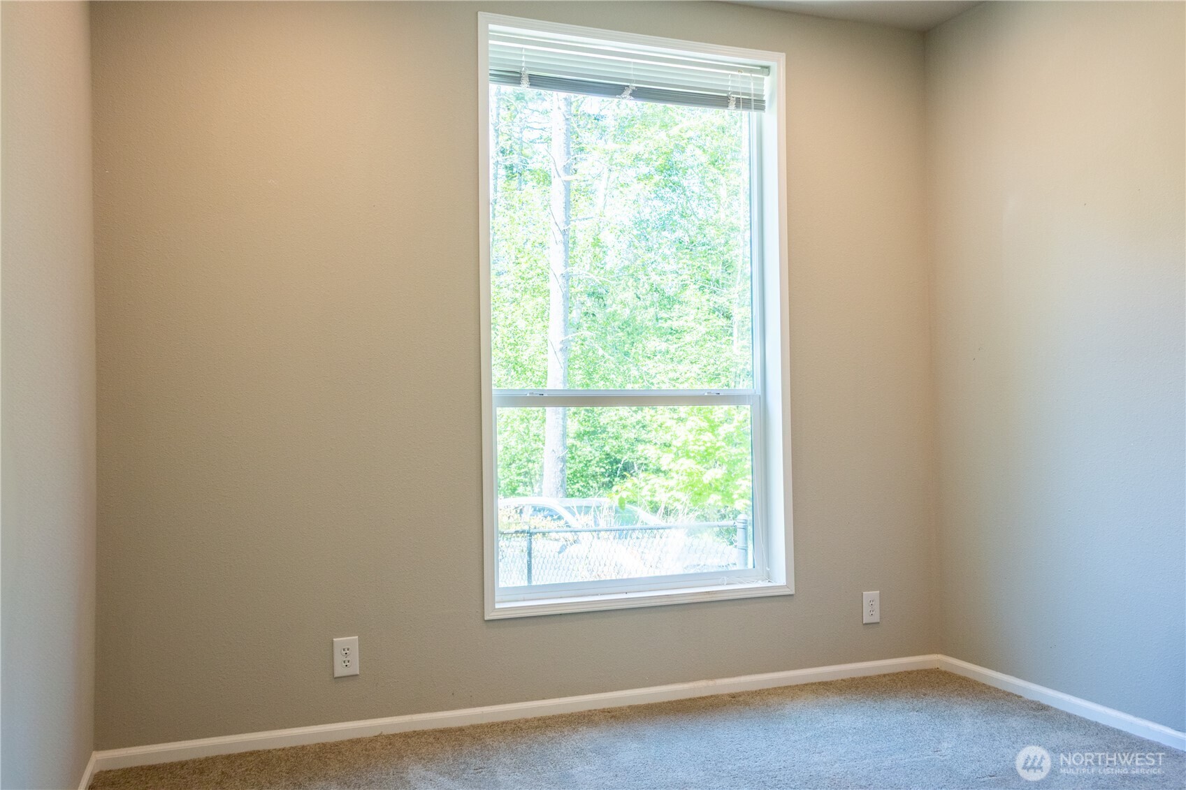 3111 East Rasor Road Belfair, WA 98528 - Photo 17 of 26 an empty room with a window