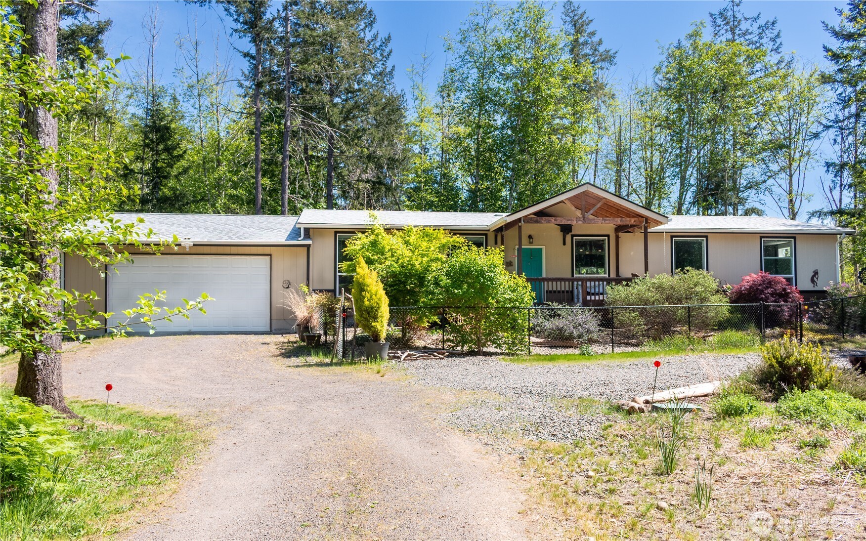 3111 East Rasor Road Belfair, WA 98528 - Photo 26 of 26 front view of a house with a small yard