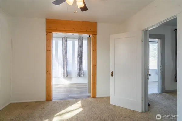 a view of a hallway with a outdoor space