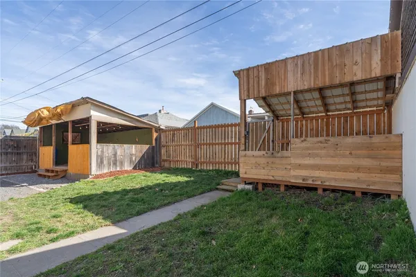 a view of a wooden house with a patio