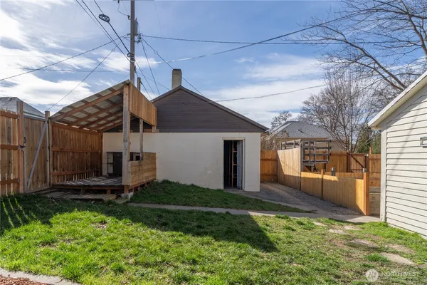 a view of a room with wooden shelves