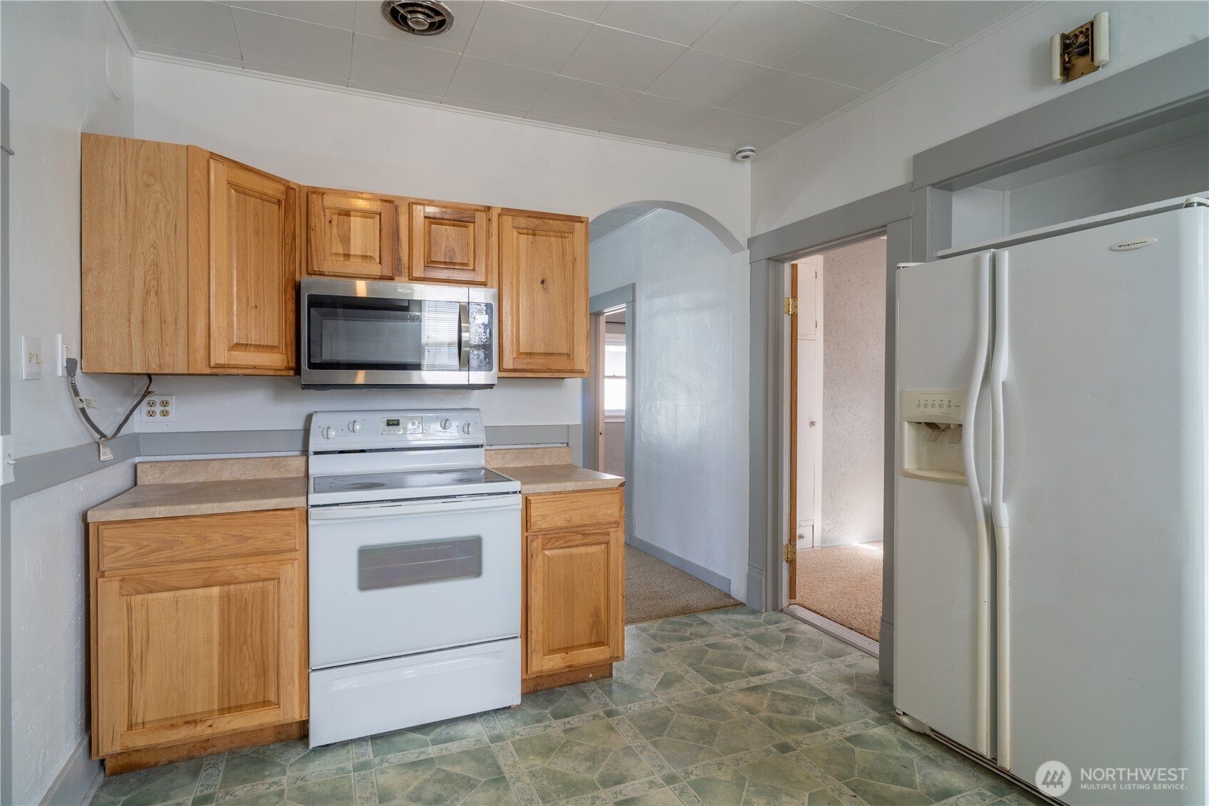 105 West 5th Avenue Ritzville, WA 99169 - Photo 8 of 40 a kitchen with a refrigerator stove and microwave