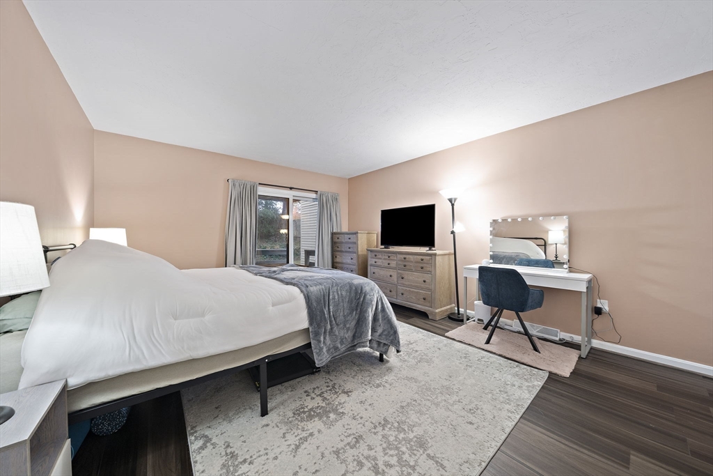 22 Union Square, Unit 22 Randolph, MA 02368 - Photo 17 of 28 a bedroom with a bed and a flat screen tv