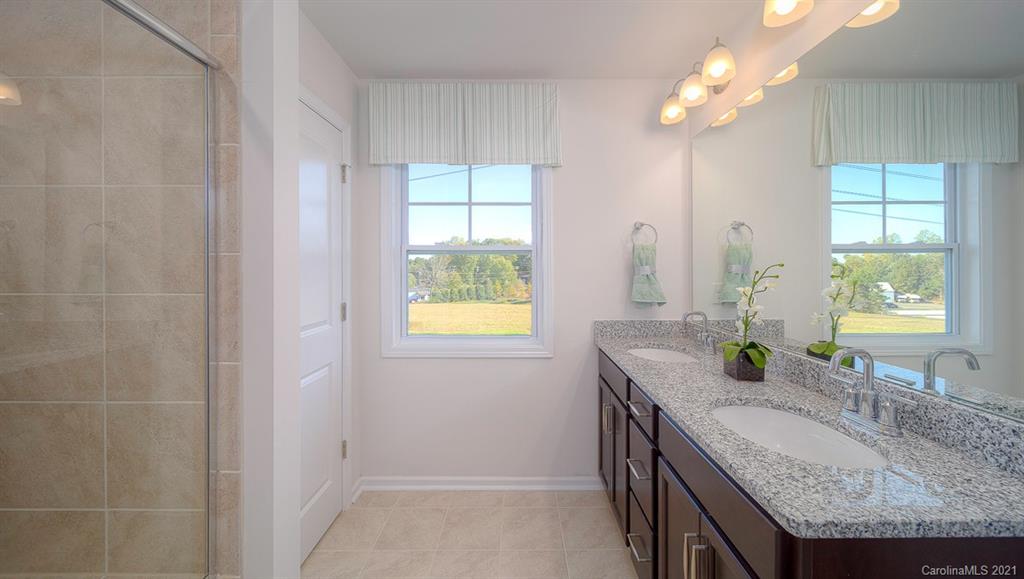 313 Bulrush Rd Lake Lake Wylie, SC 29710 - Photo 17 of 39 a bathroom with sinks granite granite and a sink