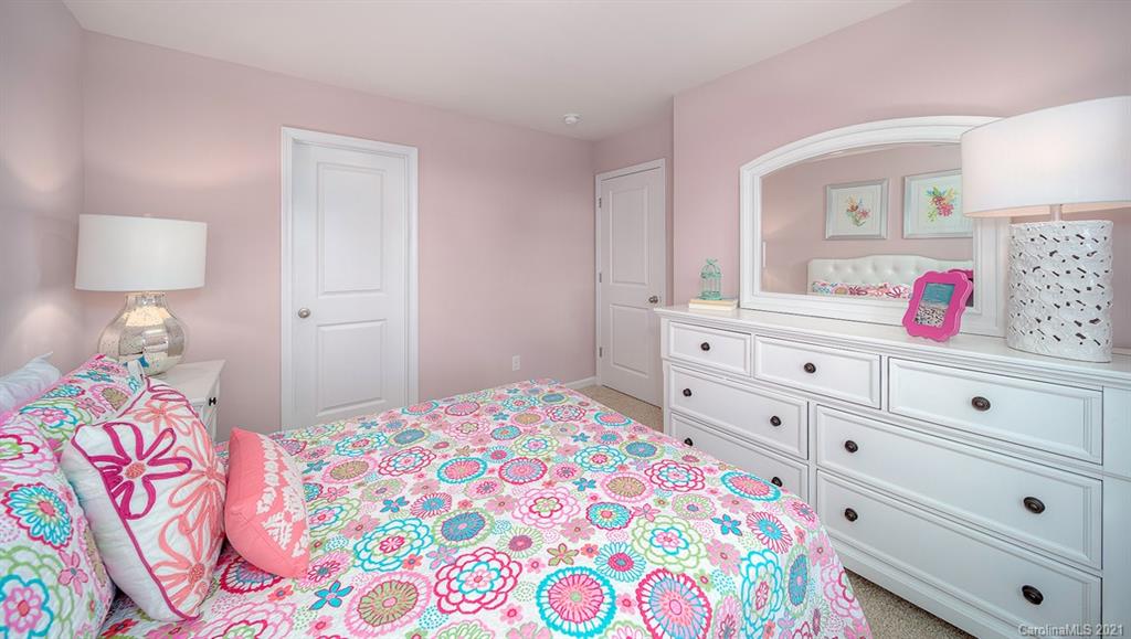 313 Bulrush Rd Lake Lake Wylie, SC 29710 - Photo 23 of 39 a bedroom with a bed and a dresser in it