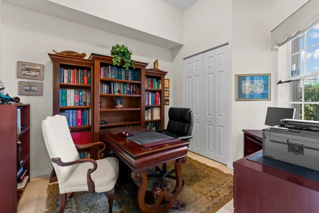 a reading room with furniture and a book shelf