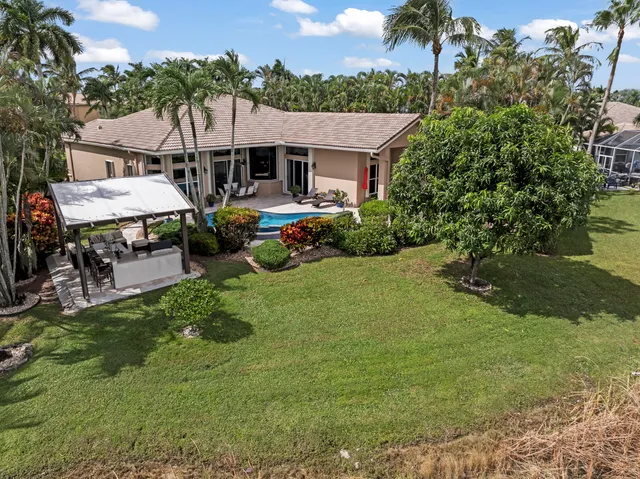 a view of house with garden and patio