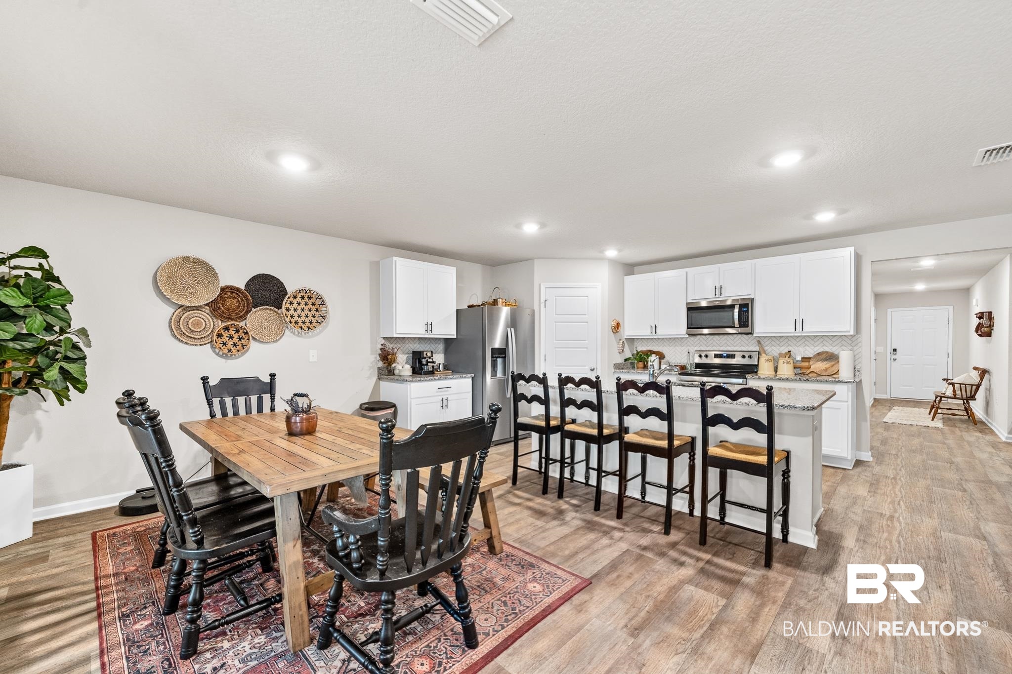 10516 Brodick Loop Daphne, AL 36527 - Photo 8 of 27 Dining area featuring light hardwood / wood-style flooring