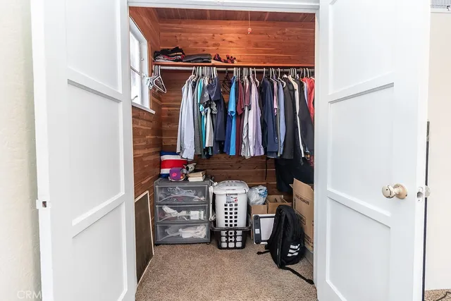 a bathroom with a tub a window and a shower