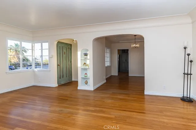a view of an entryway with wooden floor