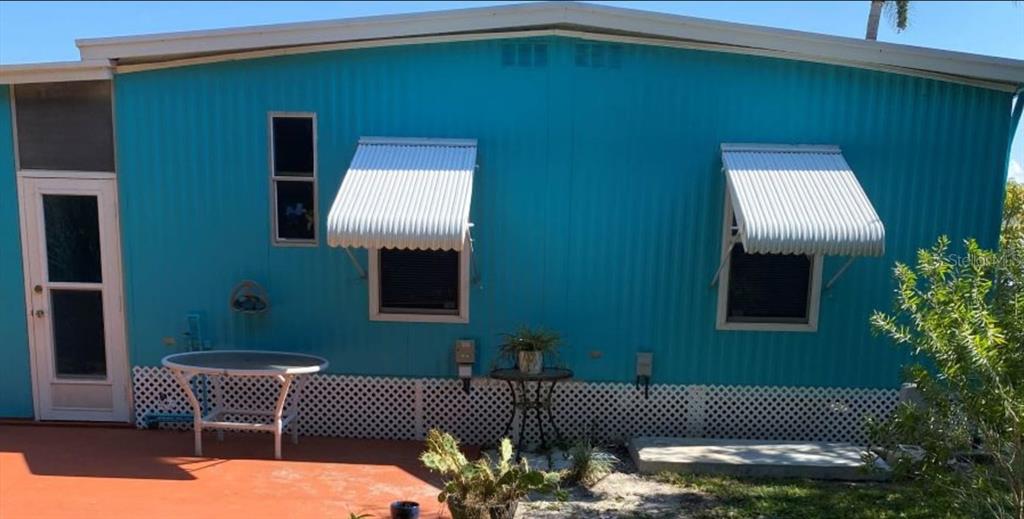 4407 Tucker Square New Port Richey, FL 34652 - Photo 12 of 69 a outdoor living space with furniture and a potted plant
