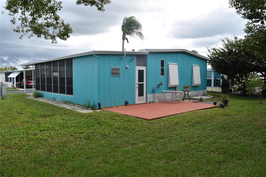 4407 Tucker Square New Port Richey, FL 34652 - Photo 13 of 69 a front view of house with yard and outdoor seating